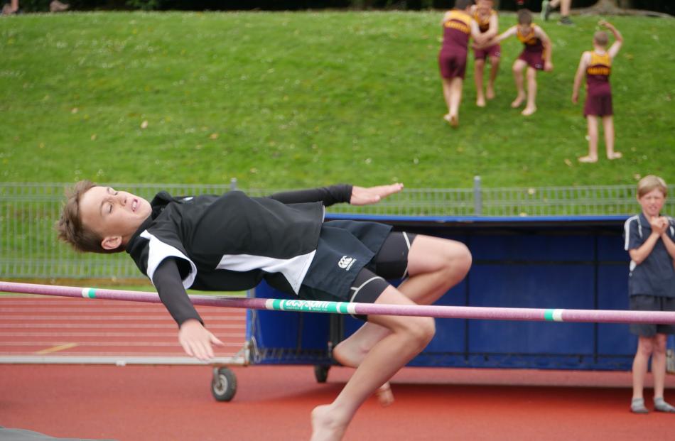 Lee Stream School pupil Charlie Nichol (10) makes it over the bar while competing in the under-11...