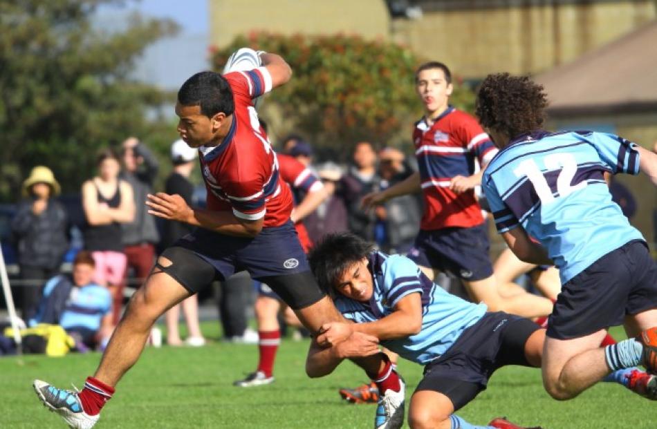 The Kavanagh centre tries to break free of a tackle.