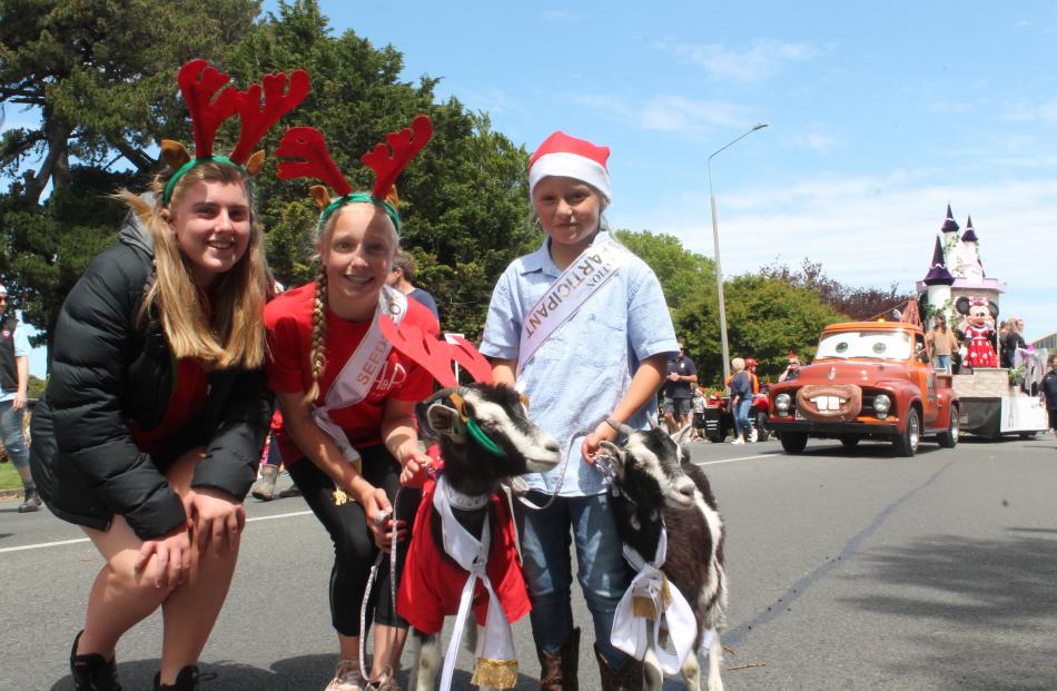 Brooke Hawker-Fennelly (14, left), Holly (13, centre) and Lucy (9) Keen with their pet goats...