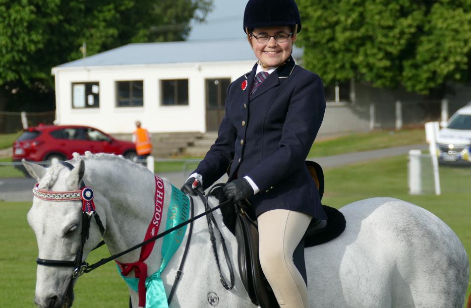 Nicole Reid (13), of Dunedin, rides Windsor Impressive, winner of the champion novice B-ring pony...