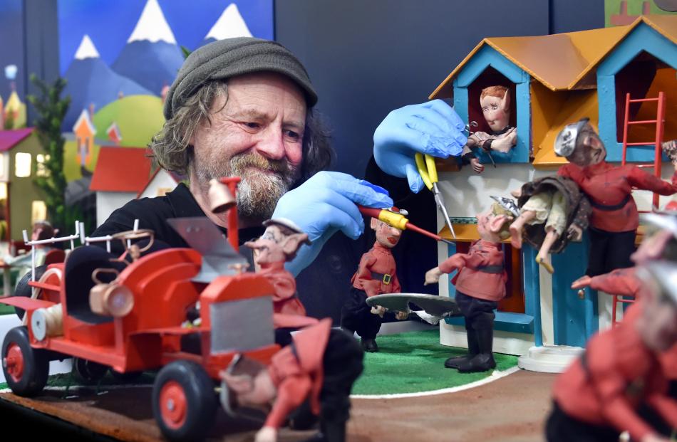 Pixie mechanic Stephen Kilroy makes some adjustments to a display at Pixie Town, which opens in...