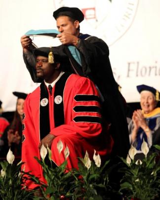 Former NBA star Shaquille O'Neal earns his doctorate in Education from Barry University in Miami,...