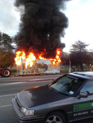 The Alexandra Pie Cart is engulfed in flames on Saturday afternoon. Photo supplied.