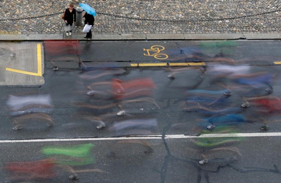 A longtime exposure shows participants taking part in the Grand Prix of Bern running event in...