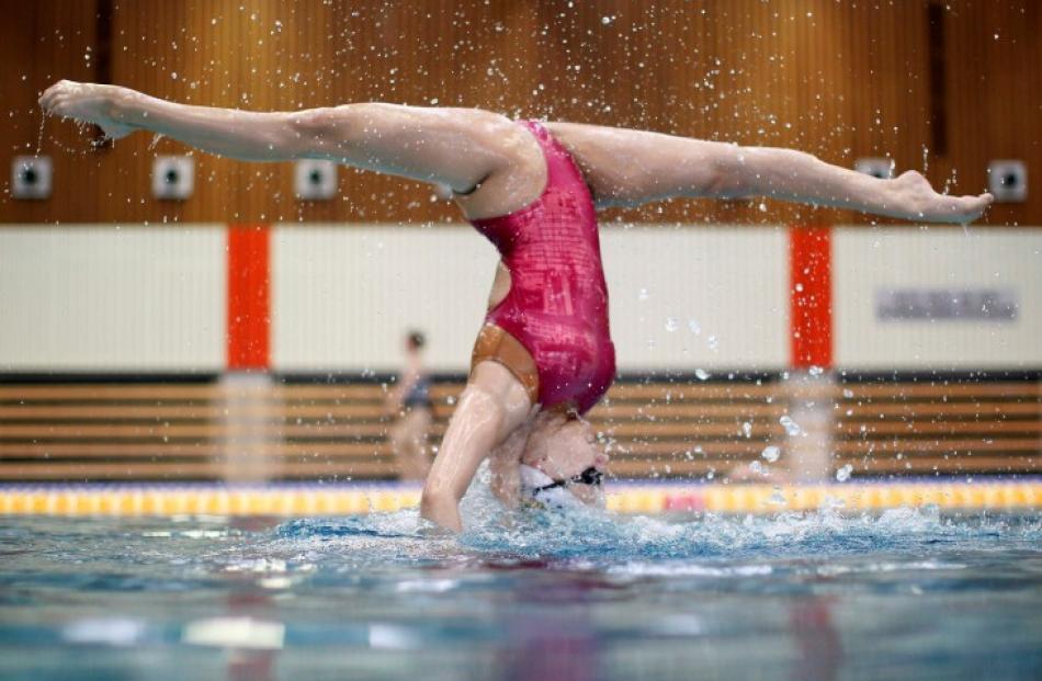 Austria's synchronised swimming duet Nadine Brandl (not pictured) and Livia Lang perform during a...