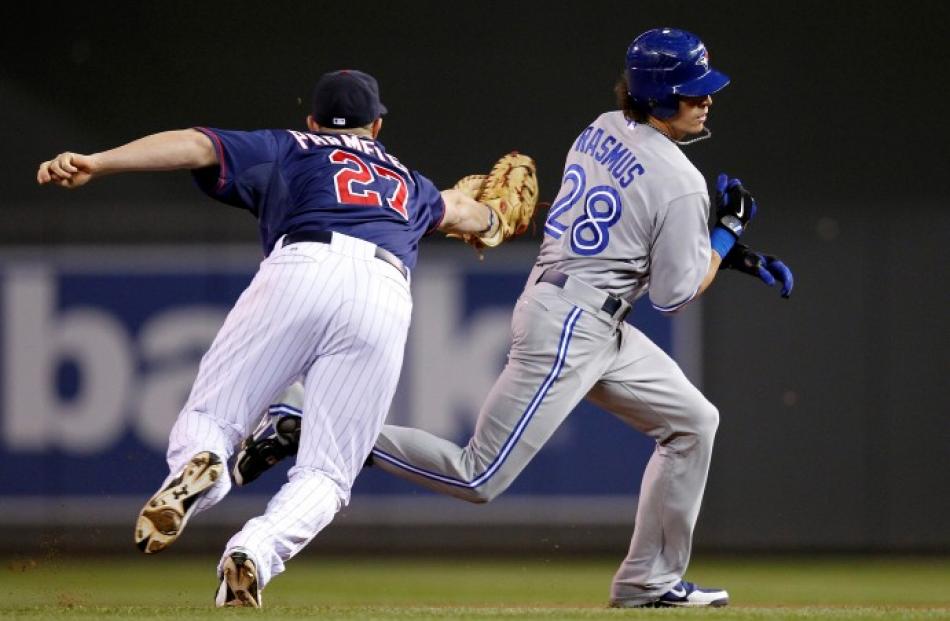 Toronto Blue Jays' Colby Rasmus is tagged out by Minnesota Twins first baseman Chris Parmelee (27...
