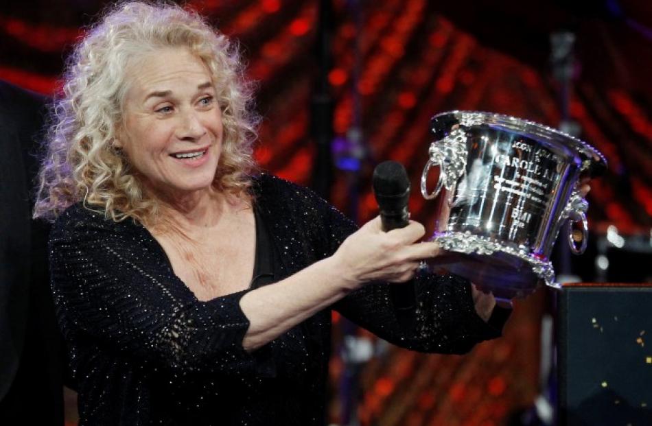 Singer-songwriter Carole King holds the BMI Icon award she received at BMI's 60th annual Pop...