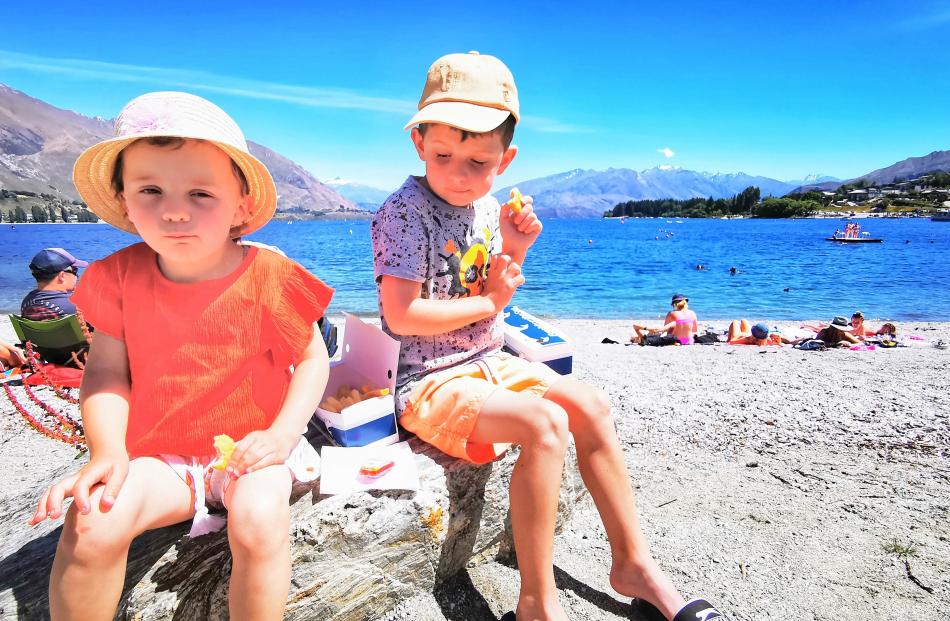 Casey (4, left) and Riley Moore (6) enjoy a picnic lunch at Lake Wanaka.PHOTO: JOHN WEKKING