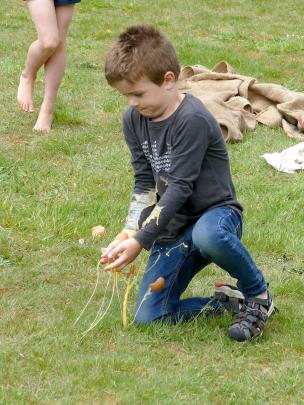 Nick Rush (6), of Wellington, is on the receiving end of a bad egg during family games at the...