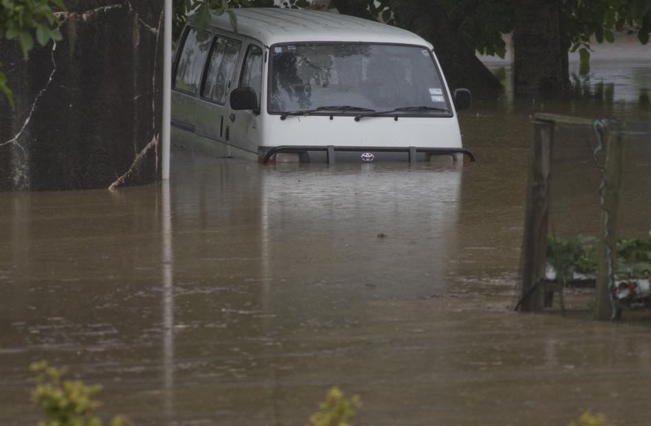 A van is partly submerged near Outram yesterday. PHOTO: GERARD O’BRIEN
