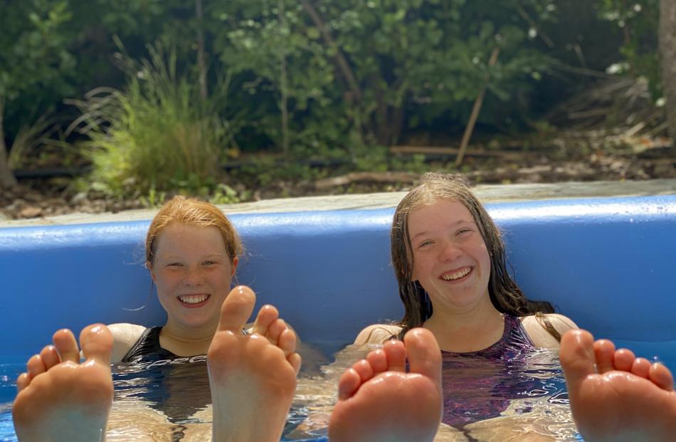 Katie Rowe (13, left) and Kate Merriman (13) relax at Tekapo Springs on Sunday. PHOTO: MELISSA...