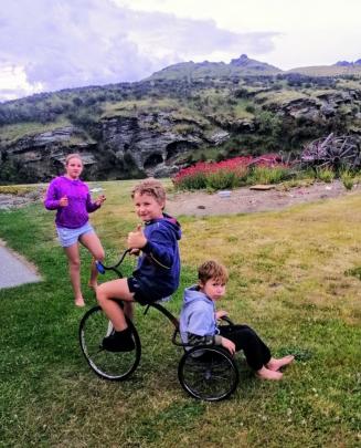 Charlotte McNeish (10) joins in the fun with her brothers Archie (8, left) and Fletcher (5), who...