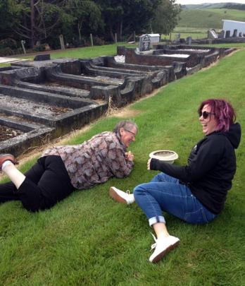 Kaye McNabb (left) and Lisa Morris enjoy some sisterly fun at the Owaka Cemetery on Boxing Day....