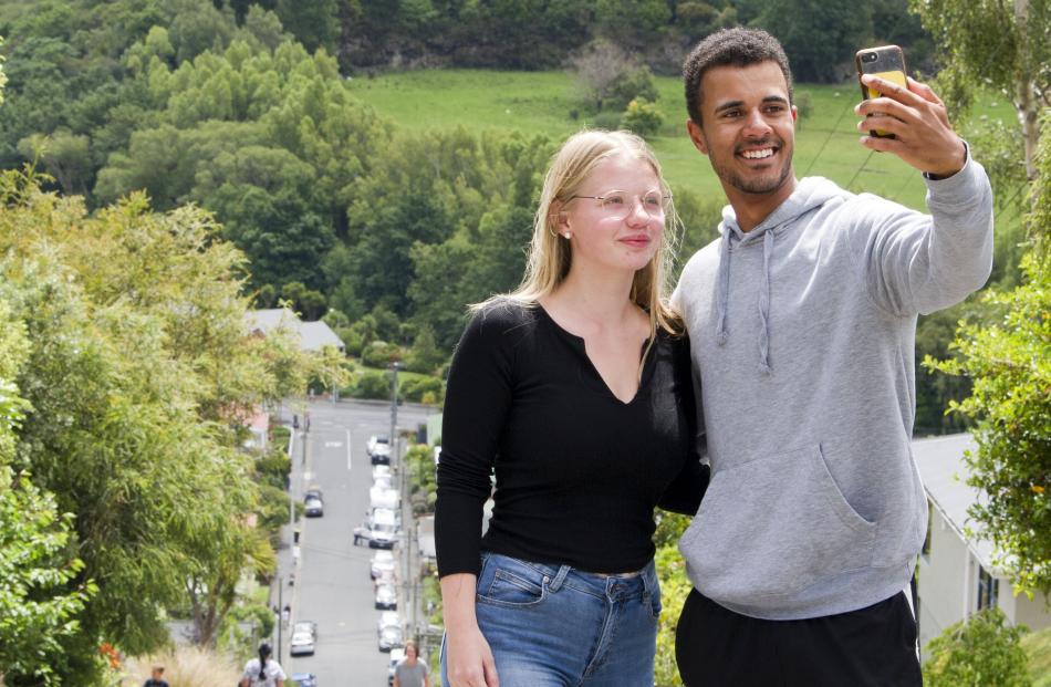 Kim Weyenberg (left) and Jordan Christiansen capture the moment atop Dunedin’s Baldwin St, the...