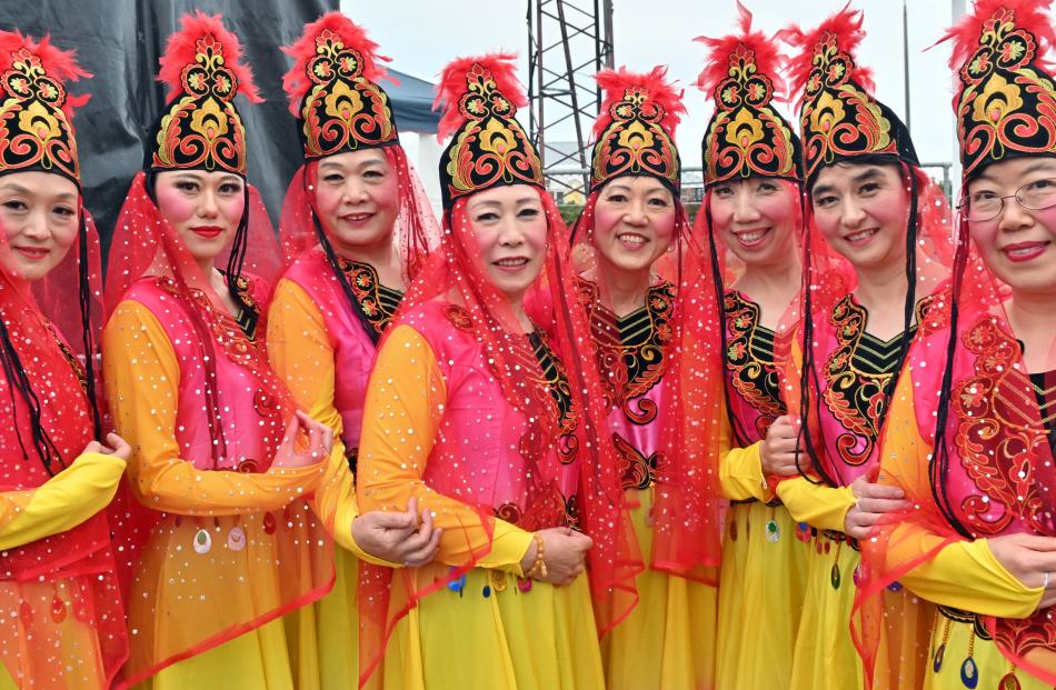 Dressed in traditional red and gold silk, members of the Dunedin Chinese and Arts Association...