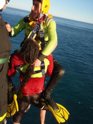 Water Rescue squad member Mark Whelan is winched into the Otago Regional Rescue Helicopter with...