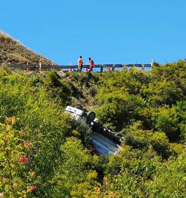 A truck came to a crashing halt on the cliff edge of the Crown Range Rd between Queenstown and...