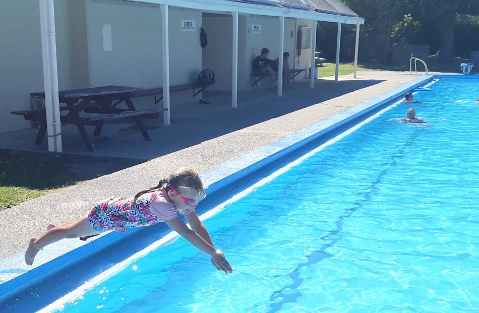 Payton McElrea (6) dives into the Millers Flat swimming pool on December 28. PHOTO: JAIME MCELREA
