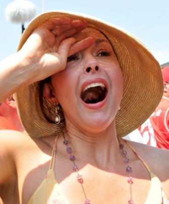 Actress Ashley Judd reacts after her husband Dario Franchitti of Scotland races to this third...