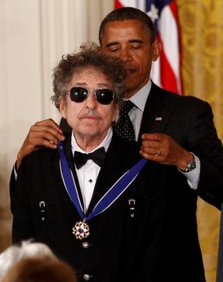 US President Barack Obama awards a 2012 Presidential Medal of Freedom to Bob Dylan during a...