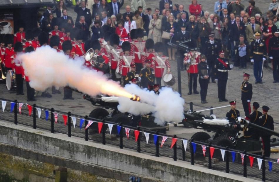 A Royal Salute is fired from the north bank of the River Thames near Tower Bridge as the Diamond...