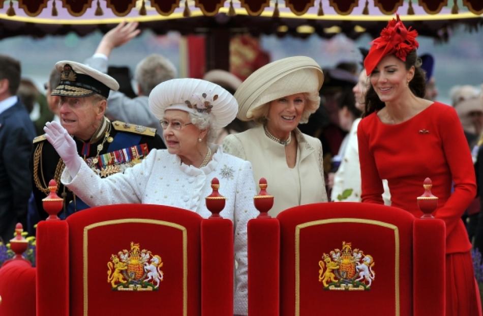 Britain's Queen Elizabeth (2nd left) waves, with Prince Philip (left), Camilla, Duchess of...