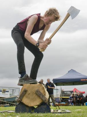 Alex Napier, of Tahakopa, competes during the Otago Axemen’s Club timber sports demonstration.