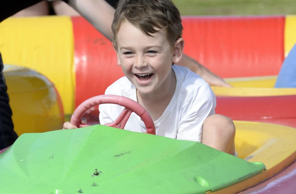 Sam Cockburn (5), of Dunedin, enjoys a ride in a bumper boat.