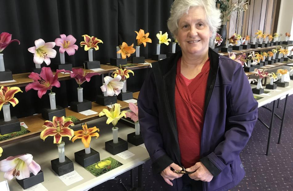 Annette Harman, of Brighton, in front of some of the florets entered in the show.

