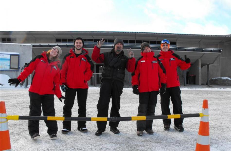 Coronet Peak workers were up on the mountain early to help the many patrons with directions. They...