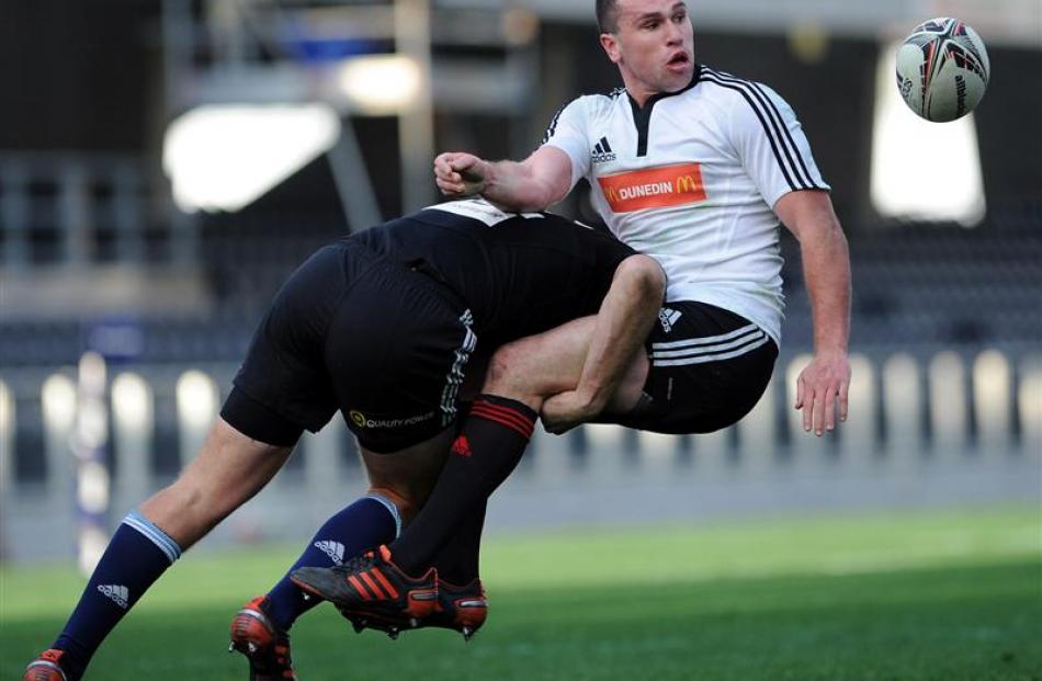 North Island second five-eighth Hadleigh Parkes tackles Marshall.