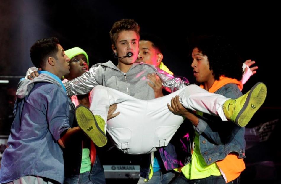 Canadian singer Justin Bieber performs at a free open-air concert at Zocalo Square in Mexico City...