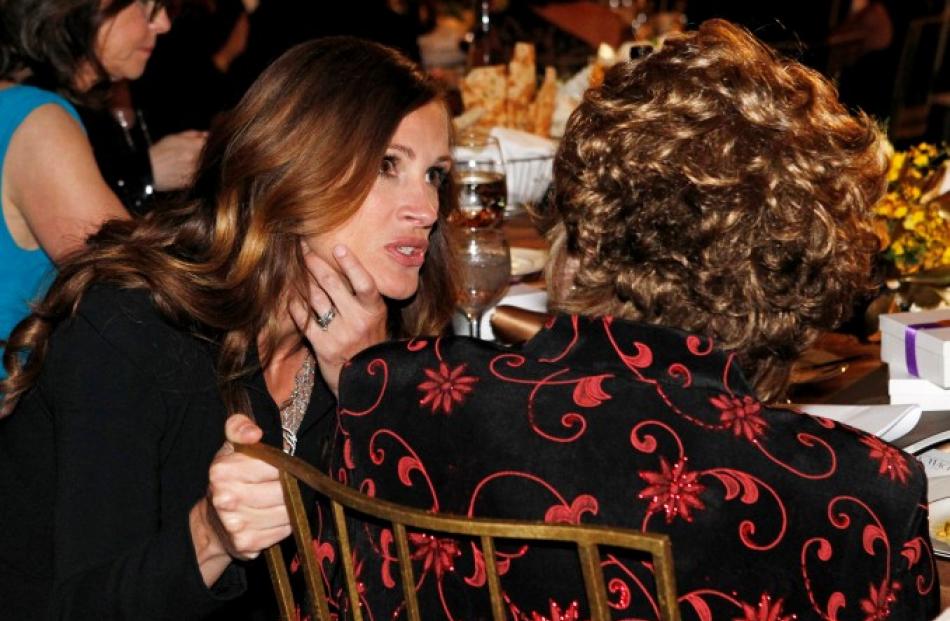 Julia Roberts (L) talks with Shirley MacLaine at the TV Land cable channel taping of the AFI Life...