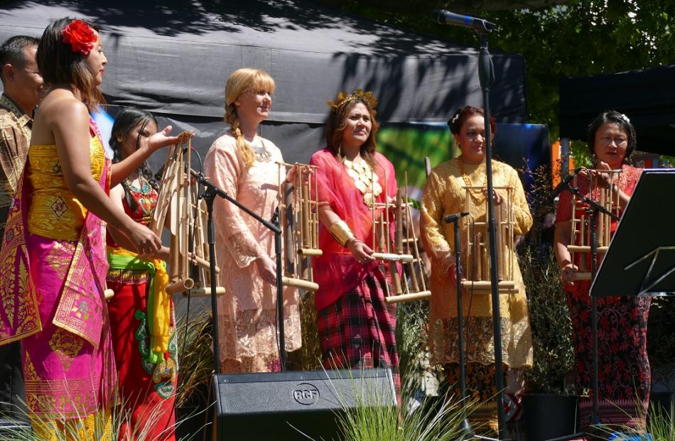 Members of Queenstown's Indonesian community perform using the angklung, a traditional instrument. 