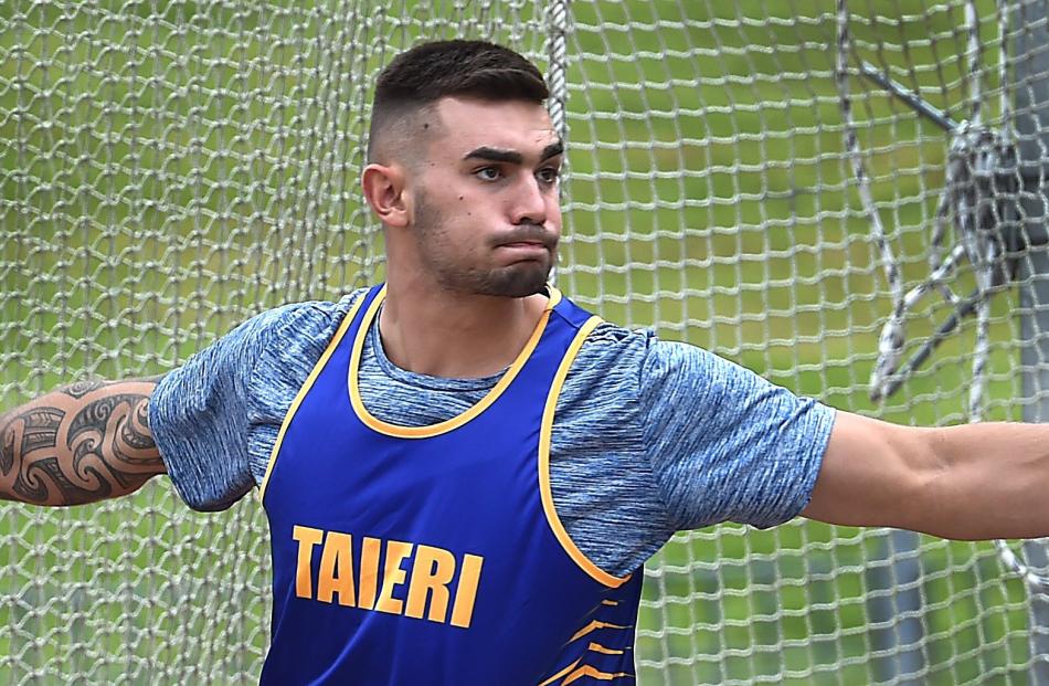 Jade Zaia (20) looks to hurl the discus at the Otago athletics championships at the Caledonian...