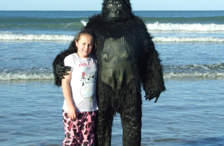 Maddie Deacon (8) and her pet gorilla Mark.