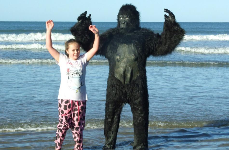 Maddie Deacon (8) and her pet gorilla Mark.