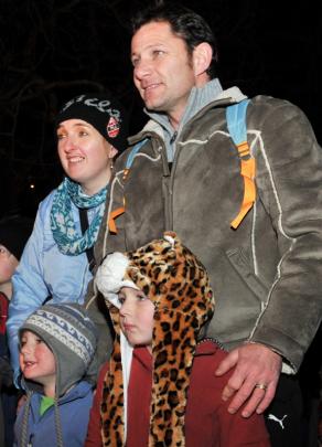 Rochelle and William Lubbe with Casey (3) and Tyler (4) watch the fire performers.