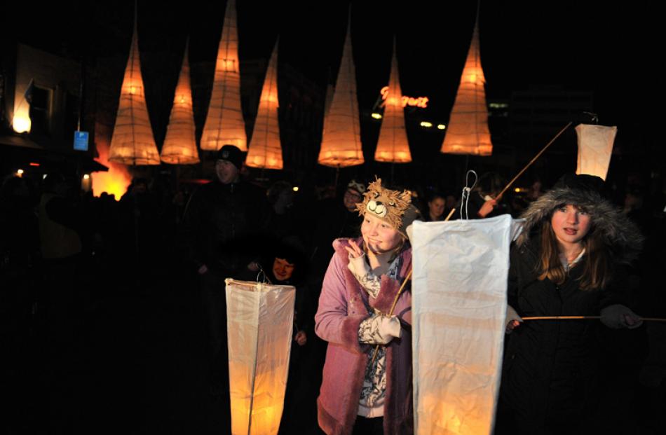 Bethany Parker-Farmer (10), Sophie Keen (13) hold their lanterns.