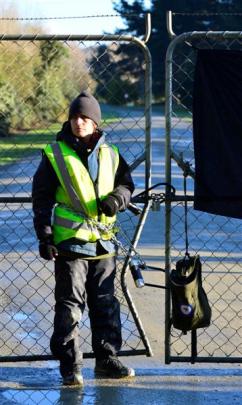 Protester Marie Brittain after padlocking herself to the main entrance gate.