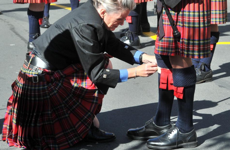 Canterbury Caledonian Pipe Band drum major Wendy Chisholm, of Christchurch, checks the band’s...