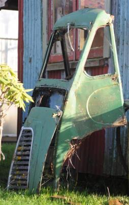 The front of a Morris van is part of the landscape.