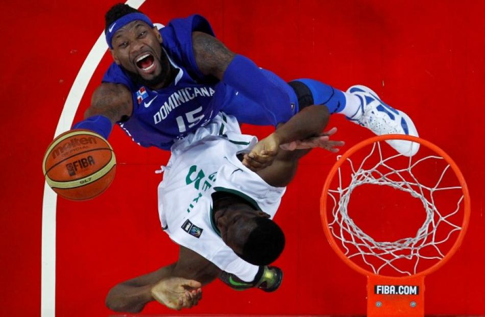 Dominican Republic's Yack Martinez (L) goes for a basket against Nigeria's Ike Diogu during their...