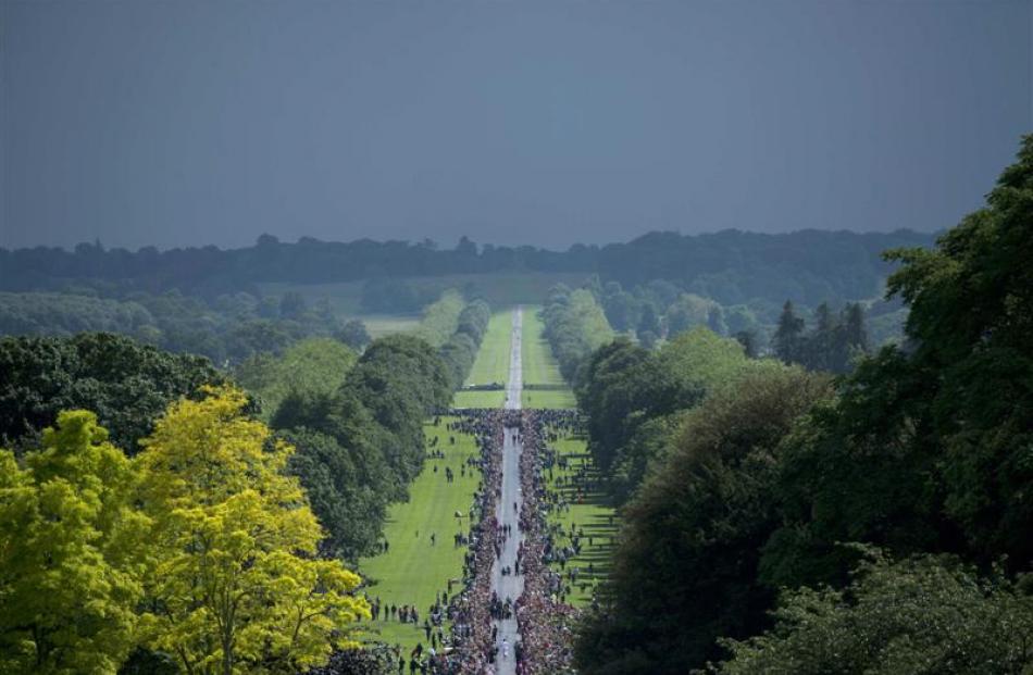 Crowds gather to watch as the Olympic Flame arrives at Windsor Castle. REUTERS/Ben Stansall/Pool