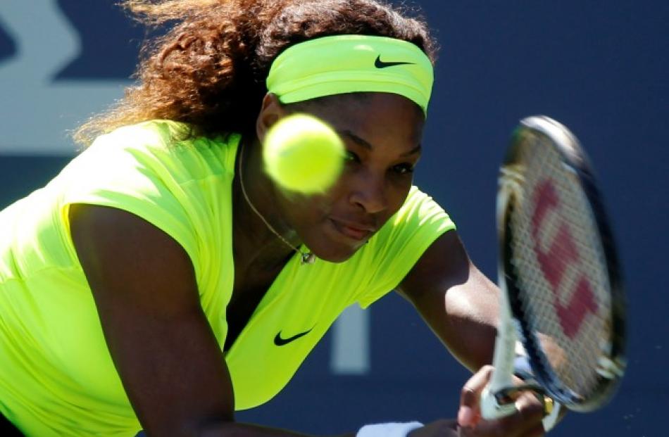 Serena Williams returns a shot to Nicole Gibbs during the Bank of the West Classic women's tennis...