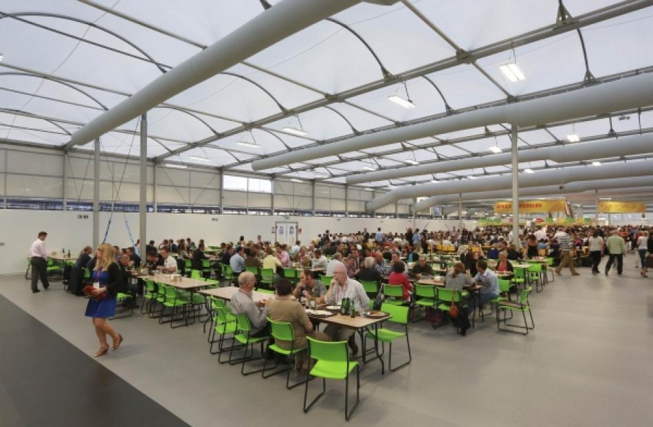 Guests test the 5,000 capacity Olympic Village dining room. Photo by Reuters.