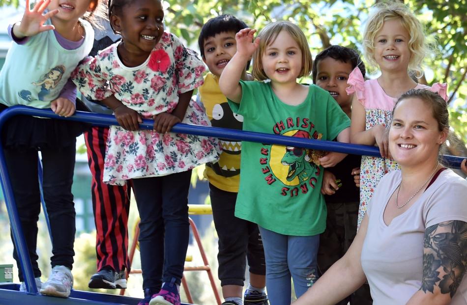 Smiling together for the 100th anniversary of the Kelsey Yaralla Kindergarten building are (from...