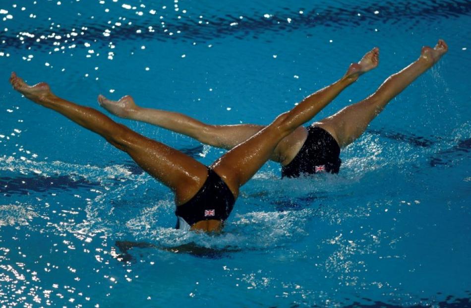 Britain's synchronised swimming Olympic team members perform a duet during a show for the Maltese...