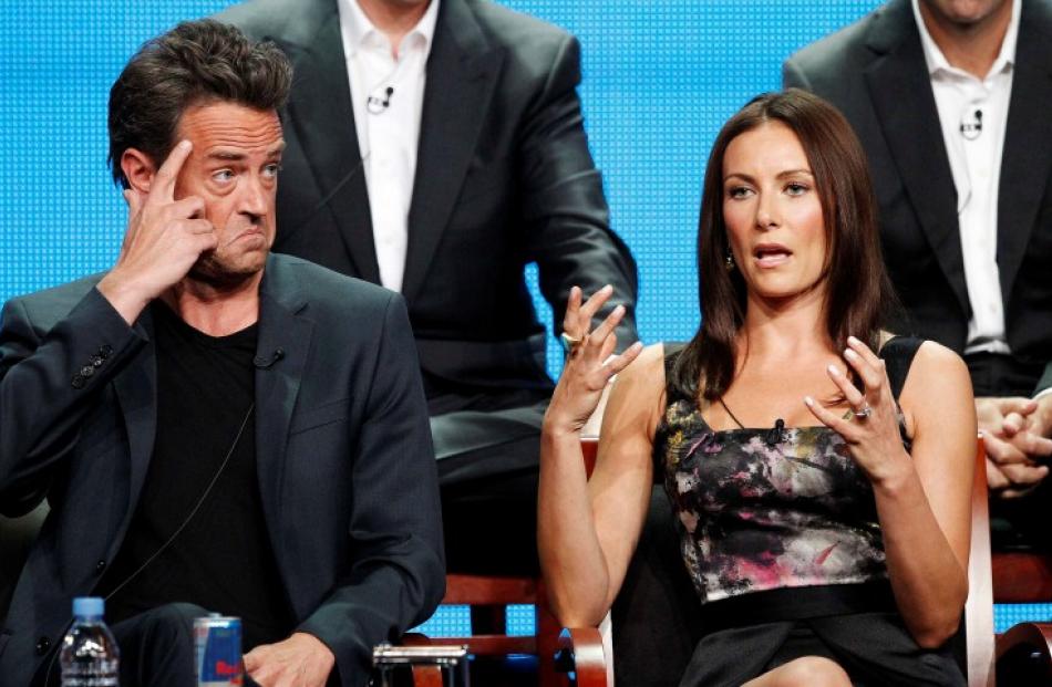 Cast members Matthew Perry and Laura Benanti attend a panel for 'Go On' in Beverly Hills. REUTERS...