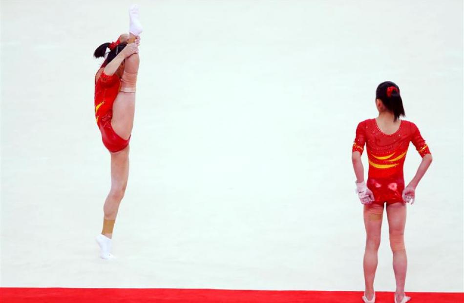 Gymnasts from China's women's team attend a training session at the North Greenwich Arena....